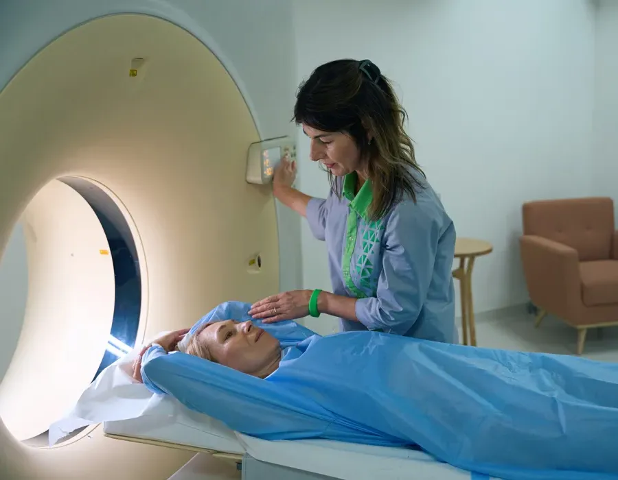 Rad tech guiding patient through X-ray procedure